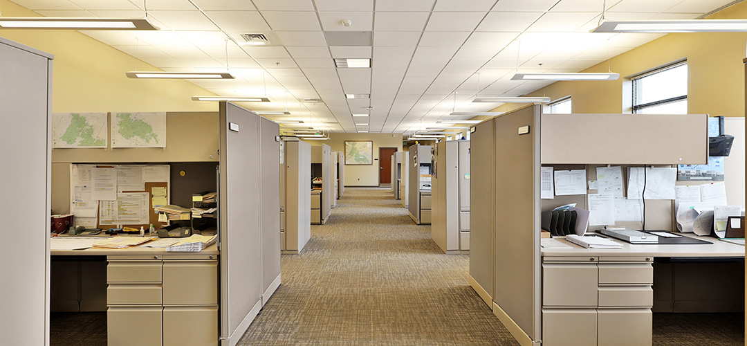 Empty hallway in modern office business building with cubicles a
